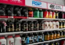 Protein powder containers displayed on store shelves for a guide to choosing the best protein powders for muscle growth.